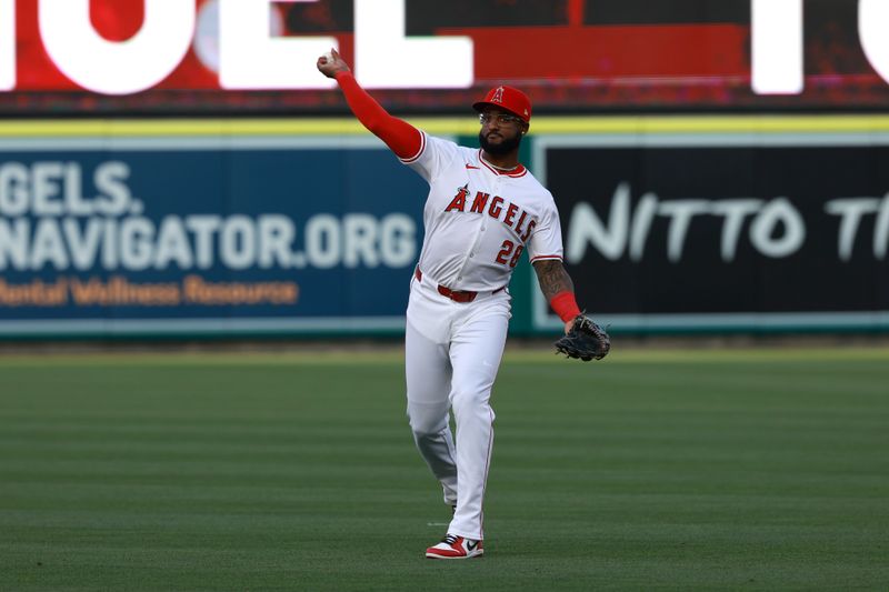 May 10, 2024; Anaheim, California, USA;  Los Angeles Angels third base Niko Goodrum (28) warms up before the game against the Kansas City Royals at Angel Stadium. Mandatory Credit: Kiyoshi Mio-USA TODAY Sports