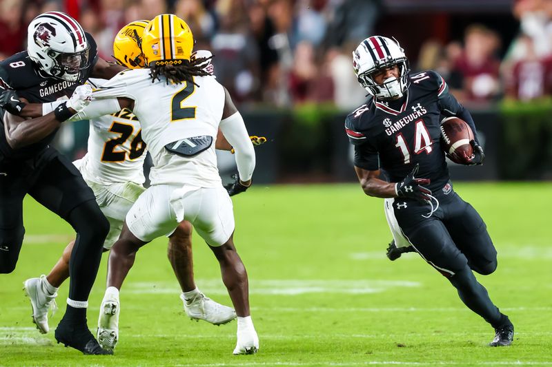 Nov 16, 2024; Columbia, South Carolina, USA; South Carolina Gamecocks wide receiver Jared Brown (14) runs after a reception against the Missouri Tigers in the second quarter at Williams-Brice Stadium. Mandatory Credit: Jeff Blake-Imagn Images