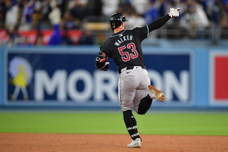 May 22, 2024; Los Angeles, California, USA; Arizona Diamondbacks first baseman Christian Walker (53) runs the bases after hitting a solo home run against the Los Angeles Dodgers during the sixth inning at Dodger Stadium. Mandatory Credit: Gary A. Vasquez-USA TODAY Sports