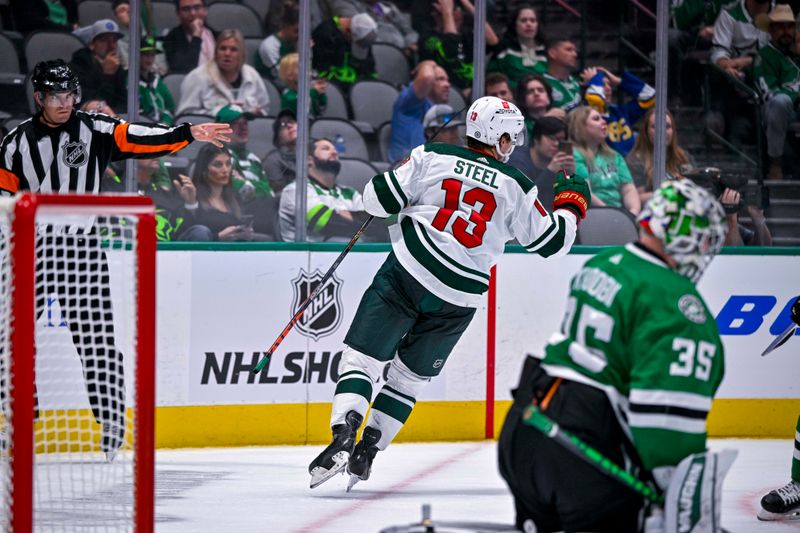 Sep 29, 2022; Dallas, Texas, USA; Minnesota Wild center Sam Steel (13) scores a goal against Dallas Stars goaltender Anton Khudobin (35) during the third period at the American Airlines Center. Mandatory Credit: Jerome Miron-USA TODAY Sports