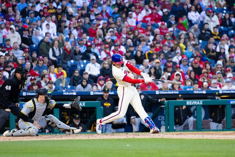 Apr 13, 2024; Philadelphia, Pennsylvania, USA; Philadelphia Phillies third base Alec Bohm (28) hits an RBI single during the eighth inning against the Pittsburgh Pirates at Citizens Bank Park. Mandatory Credit: Bill Streicher-USA TODAY Sports