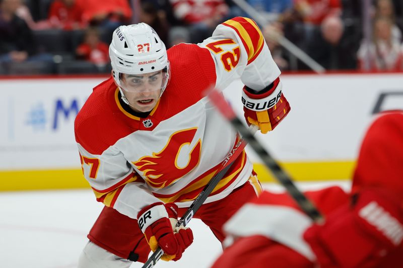 Oct 22, 2023; Detroit, Michigan, USA;  Calgary Flames right wing Matt Coronato (27) gets set during a face off in the first period against the Detroit Red Wings at Little Caesars Arena. Mandatory Credit: Rick Osentoski-USA TODAY Sports