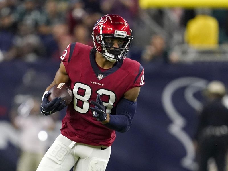 Houston Texans tight end O.J. Howard (83) gains yards after catching a pass during an NFL football game against the Philadelphia Eagles in Houston, Thursday, Nov. 3, 2022. (AP Photo/Tony Gutierrez)