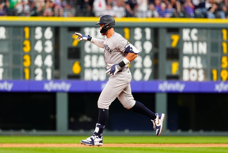 May 23, 2025; Denver, Colorado, USA; New York Yankees right fielder Aaron Judge (99) runs off a solo home run in the fifth inning against the Colorado Rockies at Coors Field. Mandatory Credit: Ron Chenoy-Imagn Images