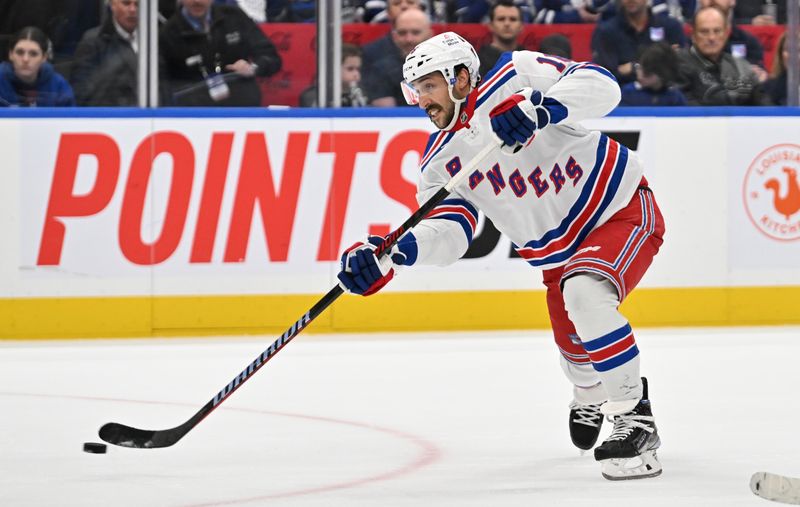 Mar 2, 2024; Toronto, Ontario, CAN;  New York Rangers forward Vincent Trochek (16) shoots the puck against the Toronto Maple Leafs in overtime at Scotiabank Arena. Mandatory Credit: Dan Hamilton-USA TODAY Sports