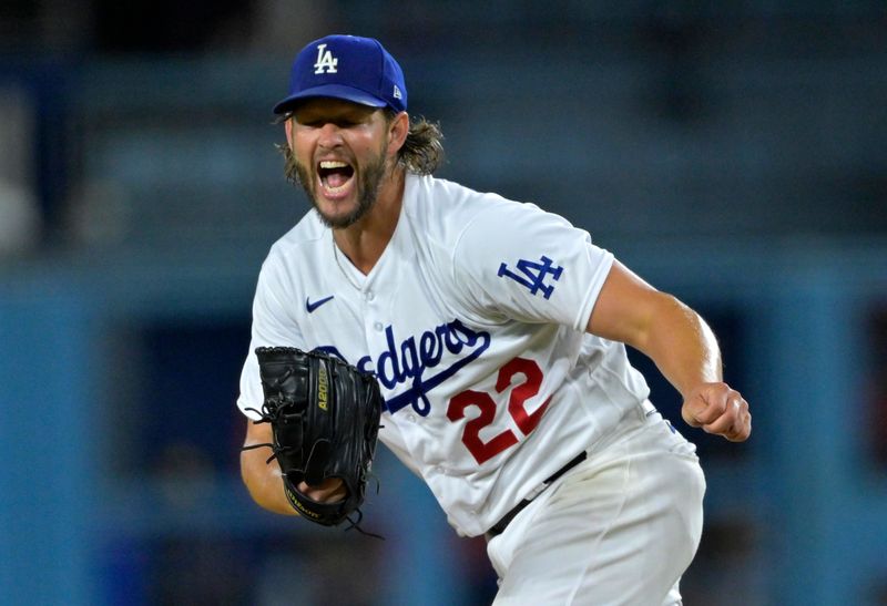 Aug 16, 2023; Los Angeles, California, USA;  Los Angeles Dodgers starting pitcher Clayton Kershaw (22) reacts after walking Milwaukee Brewers second baseman Andruw Monasterio (14) in the fourth inning at Dodger Stadium. Mandatory Credit: Jayne Kamin-Oncea-USA TODAY Sports