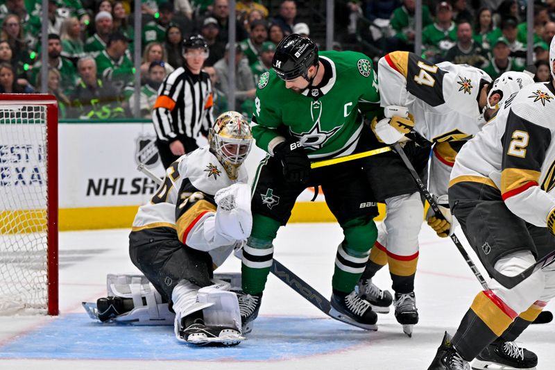 Apr 22, 2024; Dallas, Texas, USA; Dallas Stars left wing Jamie Benn (14) attempts to redirect the puck past Vegas Golden Knights goaltender Logan Thompson (36) during the second period in game one of the first round of the 2024 Stanley Cup Playoffs at the American Airlines Center. Mandatory Credit: Jerome Miron-USA TODAY Sports