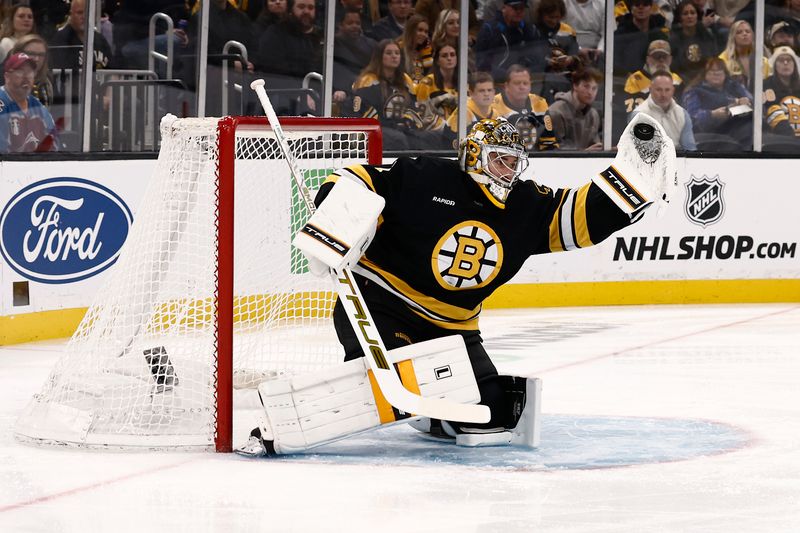 Oct 25, 2025; Boston, Massachusetts, USA; Boston Bruins goaltender Jeremy Swayman (1) makes a glove save against the Colorado Avalanche during the first period at TD Garden. Mandatory Credit: Winslow Townson-Imagn Images