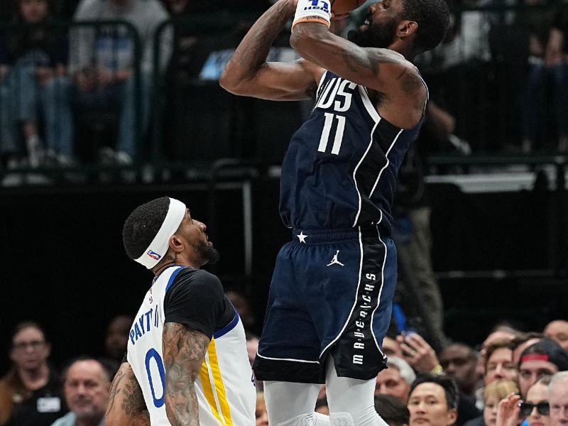 DALLAS, TX - APRIL 5: Kyrie Irving #11 of the Dallas Mavericks shoots a three point basket during the game against the Golden State Warriors on April 5, 2024 at the American Airlines Center in Dallas, Texas. NOTE TO USER: User expressly acknowledges and agrees that, by downloading and or using this photograph, User is consenting to the terms and conditions of the Getty Images License Agreement. Mandatory Copyright Notice: Copyright 2024 NBAE (Photo by Glenn James/NBAE via Getty Images)