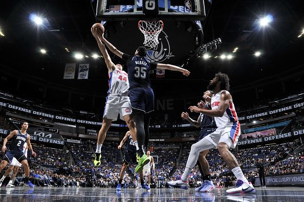 ORLANDO, FL - DECEMBER 8: Goga Bitadze #35 of the Orlando Magic blocks the shot by Bojan Bogdanovic #44 of the Detroit Pistons during the game on December 8, 2023 at Amway Center in Orlando, Florida. NOTE TO USER: User expressly acknowledges and agrees that, by downloading and or using this photograph, User is consenting to the terms and conditions of the Getty Images License Agreement. Mandatory Copyright Notice: Copyright 2023 NBAE (Photo by Fernando Medina/NBAE via Getty Images)