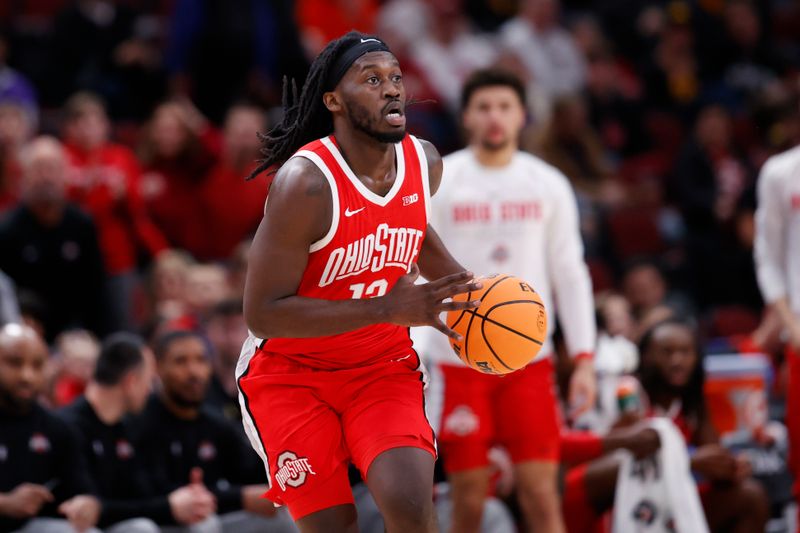 Mar 9, 2023; Chicago, IL, USA; Ohio State Buckeyes guard Isaac Likekele (13) looks to pass the ball against the Iowa Hawkeyes during the first half at United Center. Mandatory Credit: Kamil Krzaczynski-USA TODAY Sports