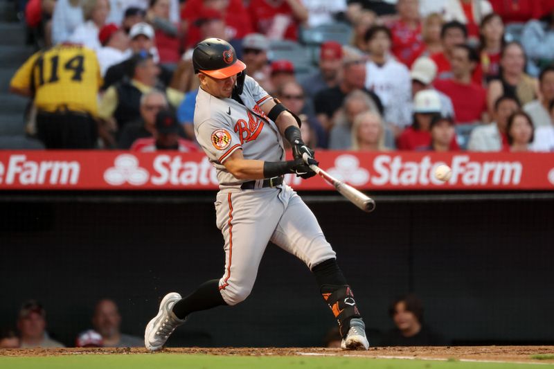 Sep 6, 2023; Anaheim, California, USA;  Baltimore Orioles second baseman Ramon Urias (29) hits an RBI single during the second inning against the Los Angeles Angels at Angel Stadium. Mandatory Credit: Kiyoshi Mio-USA TODAY Sports