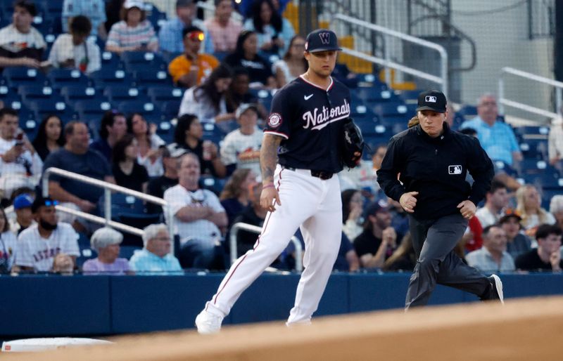 Feb 24, 2024; West Palm Beach, Florida, USA; Umpire Jen Pawol calls third base during her MLB debut between the Houston Astros and the Washington Nationals in the first inning at The Ballpark of the Palm Beaches. Mandatory Credit: Rhona Wise-USA TODAY Sports