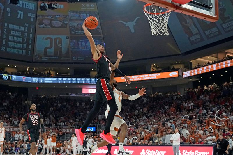 Jan 6, 2024; Austin, Texas, USA; Texas Tech Red Raiders guard Chance McMillian (0) dunks over Texas Longhorns guard Tyrese Hunter (4) during the second half at Moody Center. Mandatory Credit: Scott Wachter-USA TODAY Sports