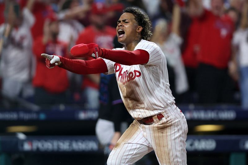 Oct 4, 2023; Philadelphia, Pennsylvania, USA; Philadelphia Phillies left fielder Cristian Pache (19) reacts after scoring a run against the Miami Marlins during the third inning for game two of the Wildcard series for the 2023 MLB playoffs at Citizens Bank Park. Mandatory Credit: Bill Streicher-USA TODAY Sports