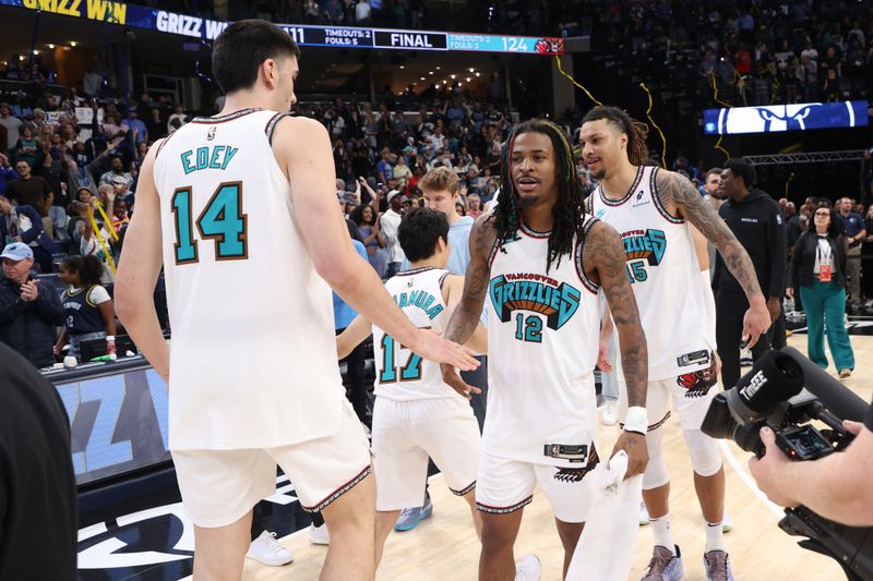 MEMPHIS, TN - OCTOBER 26: Zach Edey #14 and Ja Morant #12 of the Memphis Grizzlies high five after the game against the Orlando Magic on October 26, 2024 at FedExForum in Memphis, Tennessee. NOTE TO USER: User expressly acknowledges and agrees that, by downloading and or using this photograph, User is consenting to the terms and conditions of the Getty Images License Agreement. Mandatory Copyright Notice: Copyright 2024 NBAE (Photo by Joe Murphy/NBAE via Getty Images)