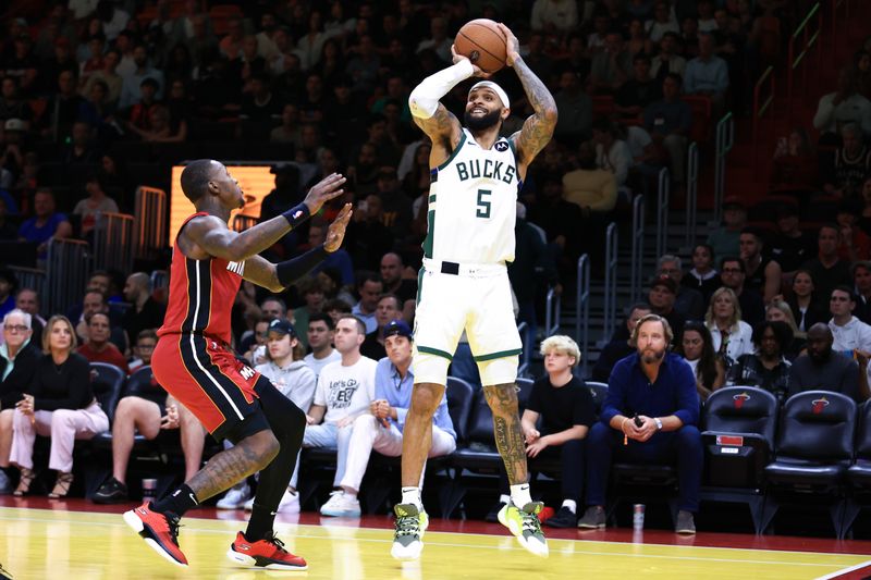 MIAMI, FLORIDA - NOVEMBER 26: Gary Trent Jr. #5 of the Milwaukee Bucks shoots the ball over Terry Rozier #2 of the Miami Heat in the second quarter of the game during the Emirates NBA Cup at Kaseya Center on November 26, 2024 in Miami, Florida. NOTE TO USER: User expressly acknowledges and agrees that, by downloading and or using this photograph, User is consenting to the terms and conditions of the Getty Images License Agreement. (Photo by Megan Briggs/Getty Images)