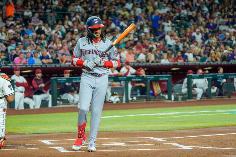 May 31, 2025; Phoenix, Arizona, USA;  Washington Nationals infielder CJ Abrams (5) reacts after getting hit by a pitch for the first time in the first inning against the Arizona Diamondbacks at Chase Field. Mandatory Credit: Allan Henry-Imagn Images