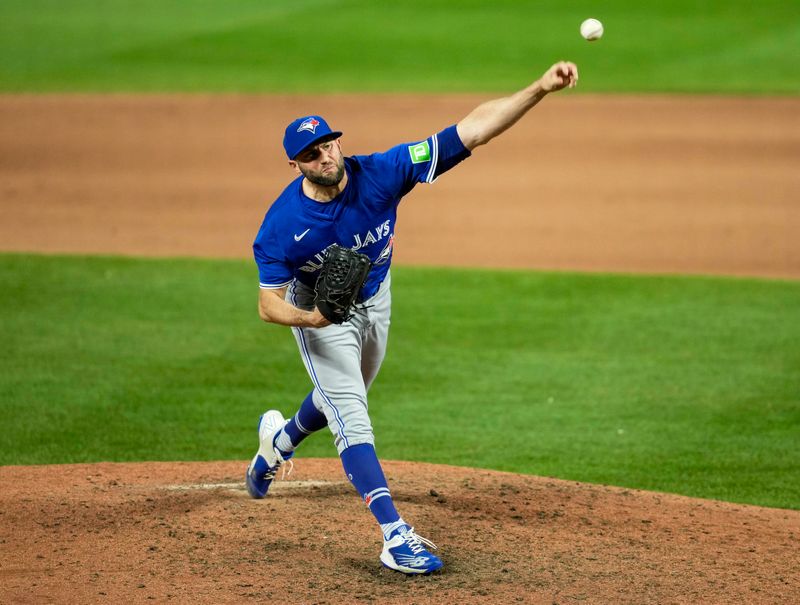 Apr 23, 2024; Kansas City, Missouri, USA; Toronto Blue Jays pitcher Tim Mayza (58) throws a pitch during the eighth inning against the Kansas City Royals at Kauffman Stadium. Mandatory Credit: Jay Biggerstaff-USA TODAY Sports