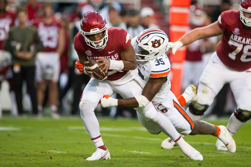 Nov 11, 2023; Fayetteville, Arkansas, USA; Arkansas Razorbacks linebacker Mani Powell (35) sacks Arkansas Razorbacks quarterback Jacolby Criswell (6) during the third quarter at Donald W. Reynolds Razorback Stadium. Auburn won 48-10. Mandatory Credit: Brett Rojo-USA TODAY Sports