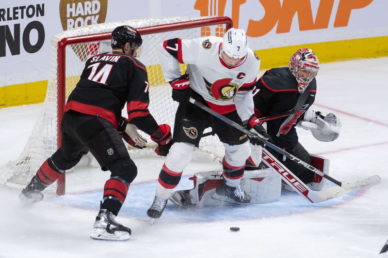 Mar 17, 2024; Ottawa, Ontario, CAN; Ottawa Senators left wing Brady Tkachuk (7) tries to settle the puck in front of Carolina Hurricanes goalie Frederik Andersen (31) during the third period at the Canadian Tire Centre. Mandatory Credit: Marc DesRosiers-USA TODAY Sports