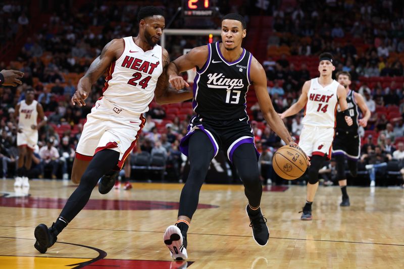 MIAMI, FLORIDA - JANUARY 31: Keegan Murray #13 of the Sacramento Kings drives against Haywood Highsmith #24 of the Miami Heat during the first quarter of the game at Kaseya Center on January 31, 2024 in Miami, Florida. NOTE TO USER: User expressly acknowledges and agrees that, by downloading and or using this photograph, User is consenting to the terms and conditions of the Getty Images License Agreement. (Photo by Megan Briggs/Getty Images)