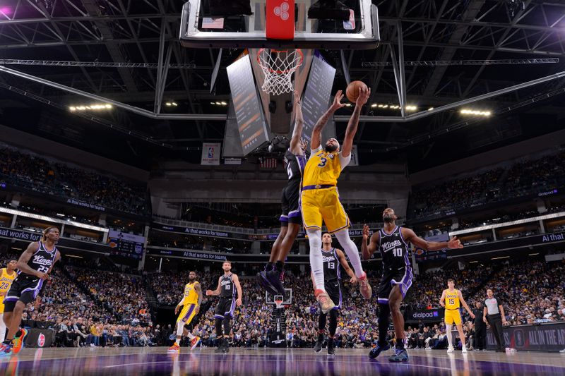 SACRAMENTO, CA - MARCH 13:  Anthony Davis #3 of the Los Angeles Lakers drives to the basket during the game against the Sacramento Kings on March 13, 2024 at Golden 1 Center in Sacramento, California. NOTE TO USER: User expressly acknowledges and agrees that, by downloading and or using this Photograph, user is consenting to the terms and conditions of the Getty Images License Agreement. Mandatory Copyright Notice: Copyright 2024 NBAE (Photo by Rocky Widner/NBAE via Getty Images)