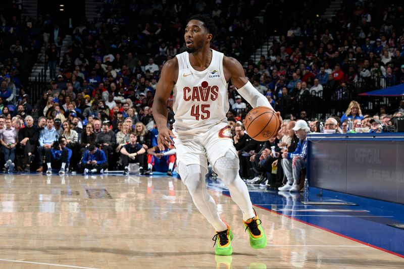 PHILADELPHIA, PA - NOVEMBER 13: Donovan Mitchell #45 of the Cleveland Cavaliers dribbles the ball during the game against the Philadelphia 76ers on November 13, 2024 at the Wells Fargo Center in Philadelphia, Pennsylvania NOTE TO USER: User expressly acknowledges and agrees that, by downloading and/or using this Photograph, user is consenting to the terms and conditions of the Getty Images License Agreement. Mandatory Copyright Notice: Copyright 2024 NBAE (Photo by David Dowt/NBAE via Getty Images)