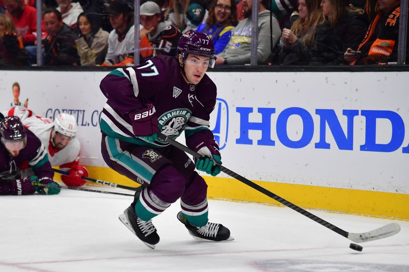 Jan 7, 2024; Anaheim, California, USA; Anaheim Ducks right wing Frank Vatrano (77) moves the puck against the Detroit Red Wings during the second period at Honda Center. Mandatory Credit: Gary A. Vasquez-USA TODAY Sports