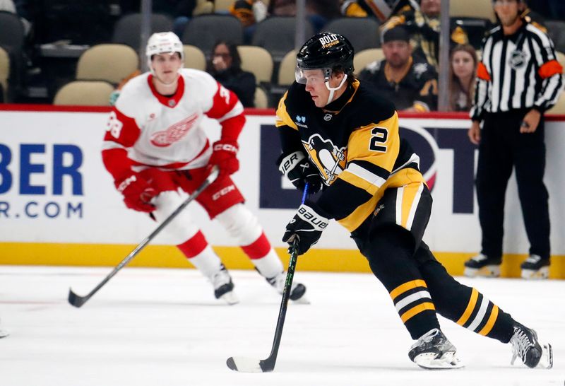 Oct 1, 2024; Pittsburgh, Pennsylvania, USA;  Pittsburgh Penguins right wing Rutger McGroarty (2) handles the puck against the Detroit Red Wings during the second period at PPG Paints Arena. Mandatory Credit: Charles LeClaire-Imagn Images