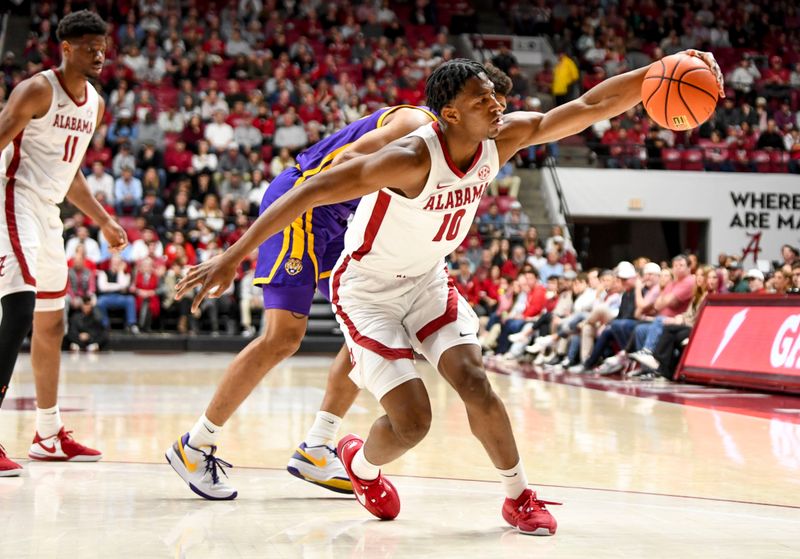 Jan 27, 2024; Tuscaloosa, Alabama, USA;  Alabama forward Mouhamed Dioubate (10) gains control of the ball after colliding with an LSU defender at Coleman Coliseum. Mandatory Credit: Gary Cosby Jr.-USA TODAY Sports