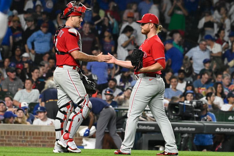 Jun 29, 2023; Chicago, Illinois, USA; Philadelphia Phillies relief pitcher Craig Kimbrel (31) and catcher J.T. Realmuto (10) after the game against the Chicago Cubs at Wrigley Field. Mandatory Credit: Matt Marton-USA TODAY Sports