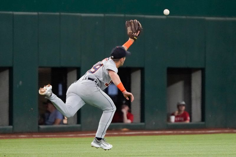 Jun 29, 2023; Arlington, Texas, USA; Detroit Tigers short stop Zack Short (59) attempts to make a catch during the first inning against the Texas Rangers at Globe Life Field. Mandatory Credit: Raymond Carlin III-USA TODAY Sports