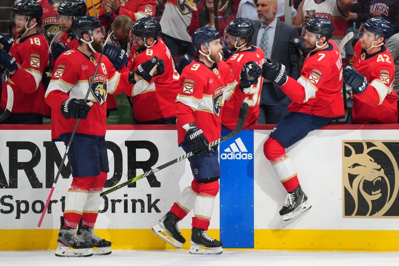 Jun 1, 2024; Sunrise, Florida, USA; Florida Panthers center Sam Bennett (9) celebrates a goal against the New York Rangers with defenseman Dmitry Kulikov (7) during the first period in game six of the Eastern Conference Final of the 2024 Stanley Cup Playoffs at Amerant Bank Arena. Mandatory Credit: Jim Rassol-USA TODAY Sports