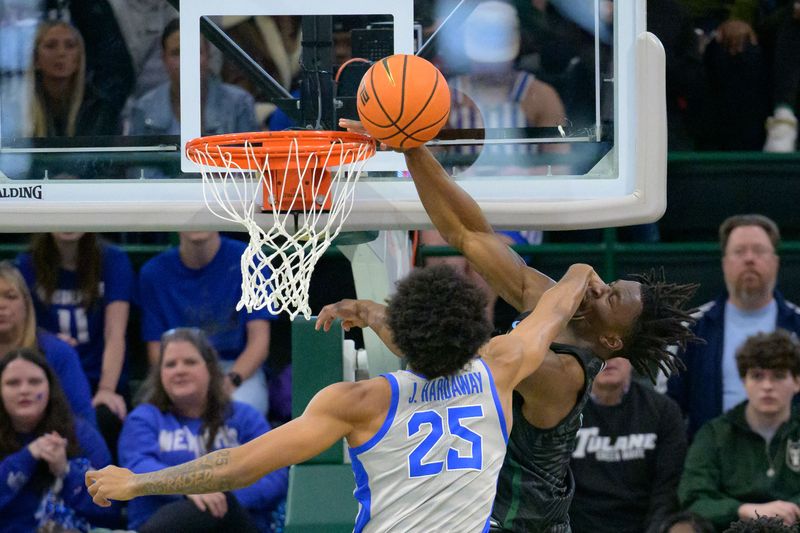 Jan 21, 2024; New Orleans, Louisiana, USA; Tulane Green Wave guard Sion James (1) gets fouled by Memphis Tigers guard Jayden Hardaway (25) during the first half at Avron B. Fogelman Arena in Devlin Fieldhouse. Mandatory Credit: Matthew Hinton-USA TODAY Sports