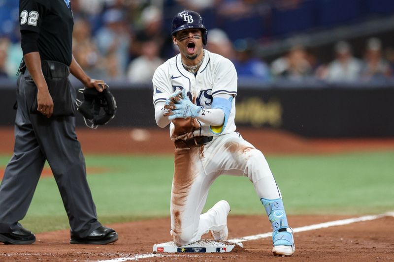 Sep 5, 2024; St. Petersburg, Florida, USA; Tampa Bay Rays second baseman Christopher Morel (24) triples against the Minnesota Twins in the eighth inning at Tropicana Field. Mandatory Credit: Nathan Ray Seebeck-Imagn Images