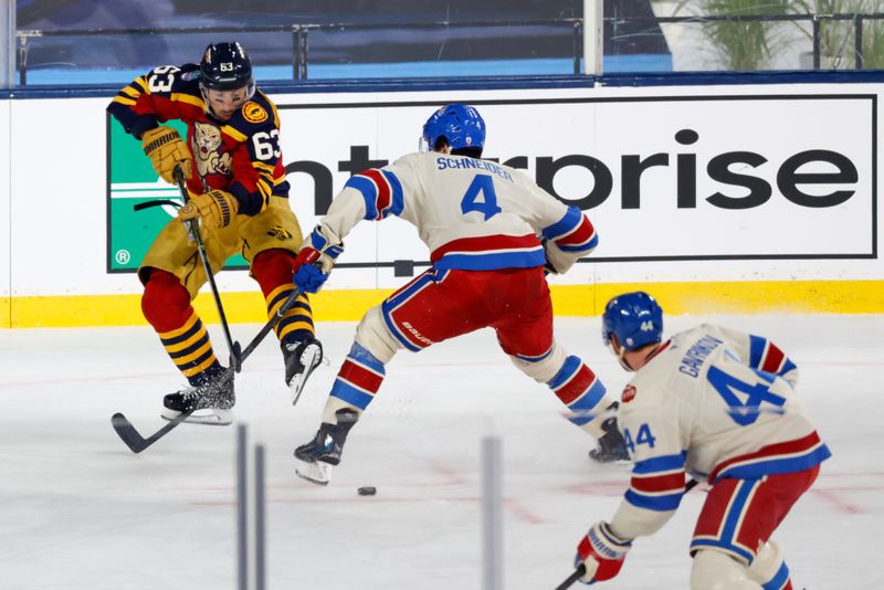 Jan 2, 2026; Miami, Florida, USA; Florida Panthers left wing Brad Marchand (63) passes the puck defended by New York Rangers defenseman Braden Schneider (4) during the first period in the 2026 Winter Classic ice hockey game at loanDepot Park. Mandatory Credit: Rhona Wise-Imagn Images