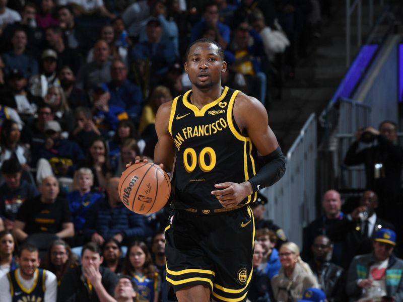 SAN FRANCISCO, CA - MARCH 22: Jonathan Kuminga #00 of the Golden State Warriors dribbles the ball during the game against the Indiana Pacers on March 22, 2024 at Chase Center in San Francisco, California. NOTE TO USER: User expressly acknowledges and agrees that, by downloading and or using this photograph, user is consenting to the terms and conditions of Getty Images License Agreement. Mandatory Copyright Notice: Copyright 2024 NBAE (Photo by Noah Graham/NBAE via Getty Images)