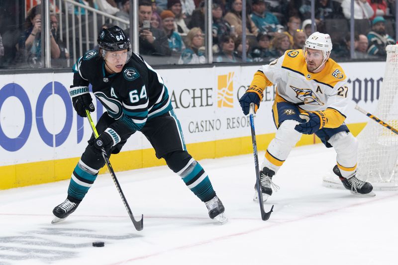 Feb 24, 2024; San Jose, California, USA; San Jose Sharks center Mikael Granlund (64) controls the puck during the second period against Nashville Predators defenseman Ryan McDonagh (27) at SAP Center at San Jose. Mandatory Credit: Stan Szeto-USA TODAY Sports