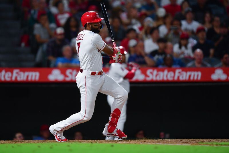 Sep 26, 2023; Anaheim, California, USA; Los Angeles Angels center fielder Jo Adell (7) hits a single against the Texas Rangers during the fifth inning  at Angel Stadium. Mandatory Credit: Gary A. Vasquez-USA TODAY Sports