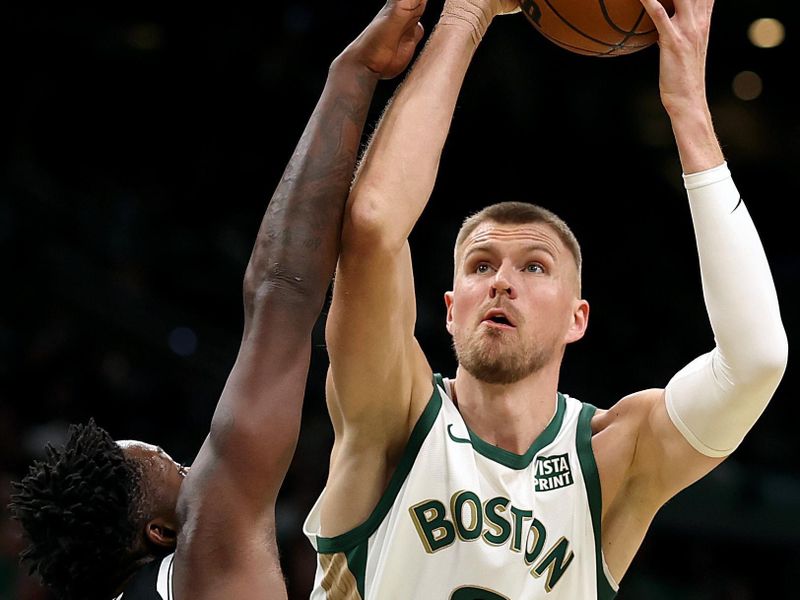 BOSTON, MASSACHUSETTS - NOVEMBER 10:  Kristaps Porzingis #8 of the Boston Celtics takes a shot against Dorian Finney-Smith #28 of the Brooklyn Nets during the first quarter of their In-Season Tournament game at TD Garden on November 10, 2023 in Boston, Massachusetts. NOTE TO USER: User expressly acknowledges and agrees that, by downloading and or using this photograph, User is consenting to the terms and conditions of the Getty Images License Agreement. (Photo by Maddie Meyer/Getty Images)