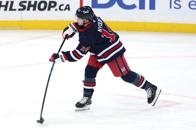 Oct 24, 2025; Winnipeg, Manitoba, CAN; Winnipeg Jets right wing Gustav Nyquist (14) warms up before a game against the Calgary Flames at Canada Life Centre. Mandatory Credit: James Carey Lauder-Imagn Images