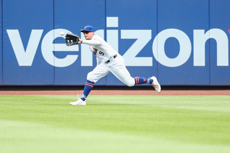 Jun 30, 2024; New York City, New York, USA;  New York Mets center fielder Brandon Nimmo (9) makes a running catch in the first inning against the Houston Astros at Citi Field. Mandatory Credit: Wendell Cruz-USA TODAY Sports