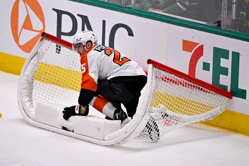 Mar 22, 2025; Dallas, Texas, USA; Philadelphia Flyers center Ryan Poehling (25) crashes into the net past Dallas Stars goaltender Jake Oettinger (not pictured) during the first period at the American Airlines Center. Mandatory Credit: Jerome Miron-Imagn Images