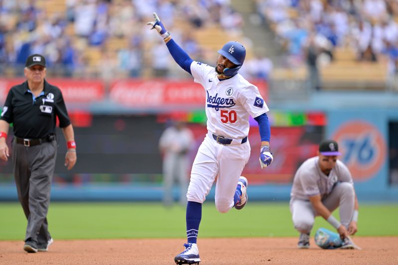 Jun 2, 2024; Los Angeles, California, USA;  Los Angeles Dodgers shortstop Mookie Betts (50) rounds the bases after hitting a solo home run in the first inning against the Colorado Rockies at Dodger Stadium. Mandatory Credit: Jayne Kamin-Oncea-USA TODAY Sports