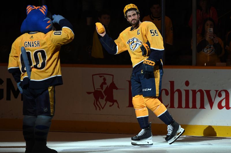 Feb 27, 2024; Nashville, Tennessee, USA; Nashville Predators defenseman Roman Josi (59) skates after being named the first star of the game following a win against the Ottawa Senators at Bridgestone Arena. Mandatory Credit: Christopher Hanewinckel-USA TODAY Sports