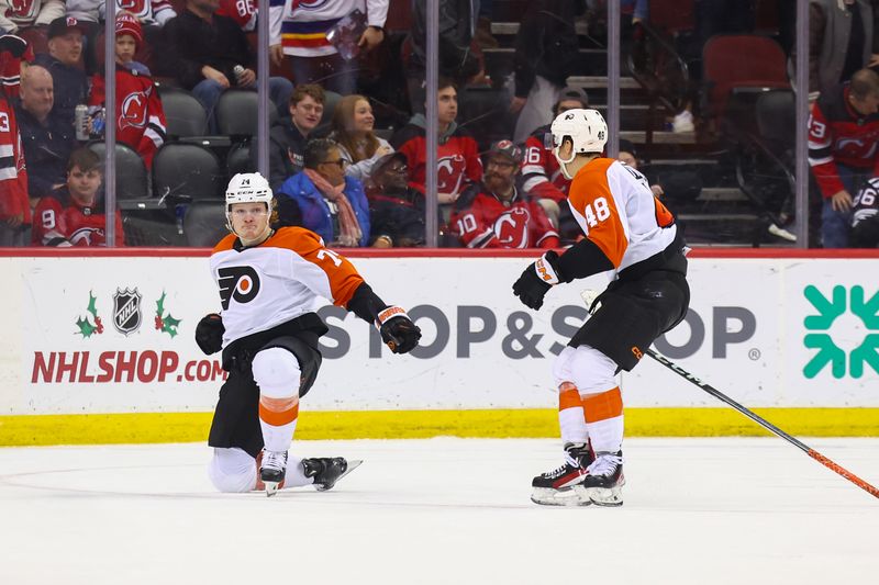 Dec 19, 2023; Newark, New Jersey, USA; Philadelphia Flyers right wing Owen Tippett (74) celebrates his game-winning goal against the New Jersey Devils during overtime at Prudential Center. Mandatory Credit: Ed Mulholland-USA TODAY Sports