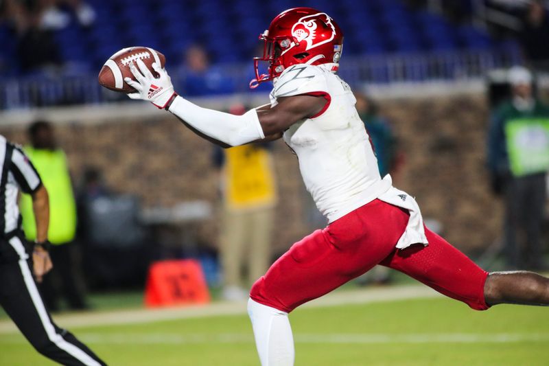 Nov 18, 2021; Durham, North Carolina, USA;  Louisville Cardinals wide receiver Ahmari Huggins-Bruce (9) celebrates a touchdown during the 2nd half of the game against the Louisville Cardinals at Wallace Wade Stadium. Mandatory Credit: Jaylynn Nash-USA TODAY Sports