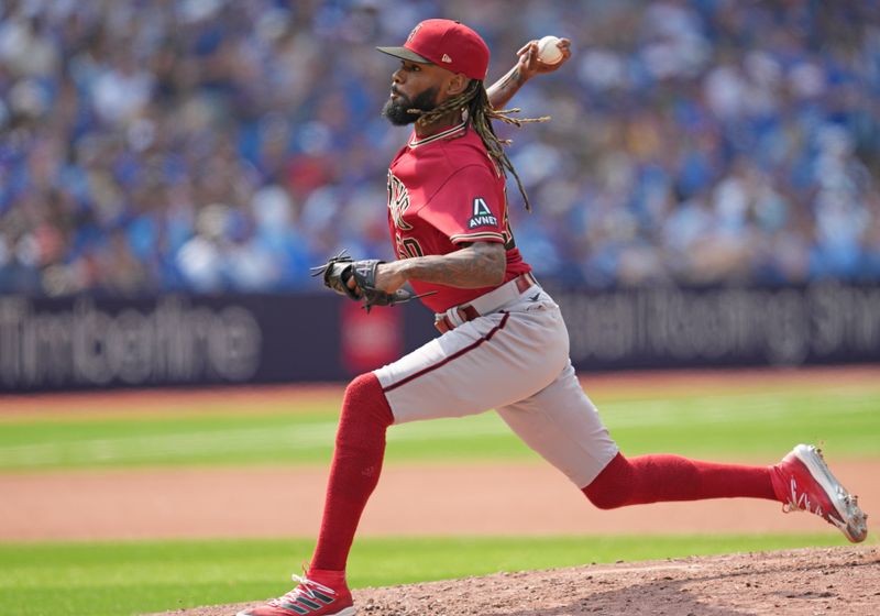 Jul 16, 2023; Toronto, Ontario, CAN; Arizona Diamondbacks relief pitcher Miguel Castro (50) throws a pitch against the Toronto Blue Jays during the seventh inning at Rogers Centre. Mandatory Credit: Nick Turchiaro-USA TODAY Sports