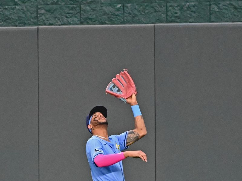 Jul 3, 2024; Kansas City, Missouri, USA;  Tampa Bay Rays center fielder Jose Siri (22) catches a fly ball in the fourth inning against the Kansas City Royals at Kauffman Stadium. Mandatory Credit: Peter Aiken-USA TODAY Sports